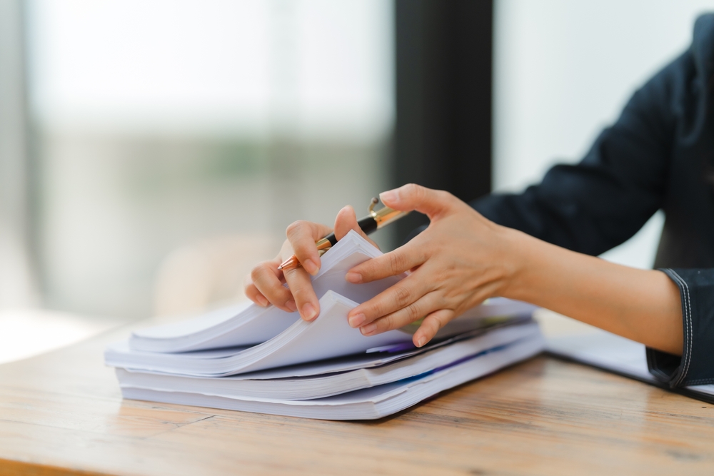 Businesswoman,Reviewing,Documents:,A,Close-up,Of,A,Businesswoman's,Hands,Meticulously Documents you need for a home loan application (checklist)