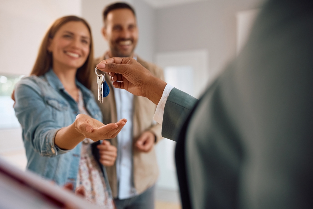Close,Up,Of,Happy,Couple,Receiving,Keys,Of,Their,New First-time buyer’s guide to getting your bond approved in South Africa