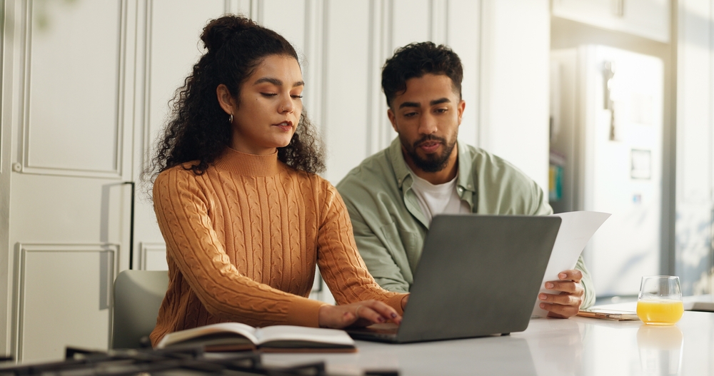 Laptop,,Documents,And,Typing,With,Couple,In,Kitchen,For,Bills, How much home loan can I afford?
